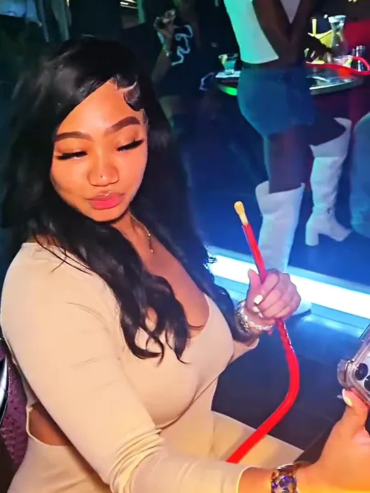 Guest with a hookah at Pluto Lounge